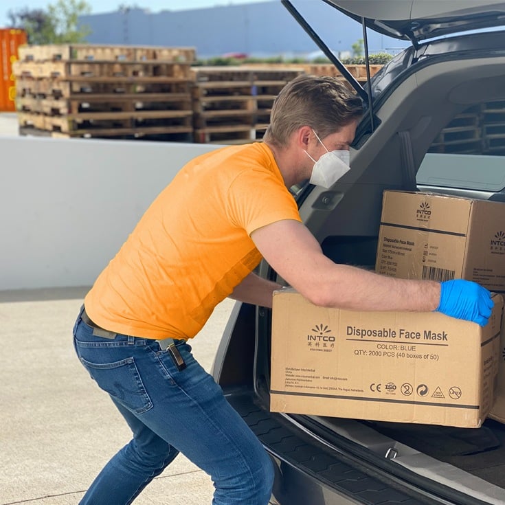 Volunteer loading health supplies